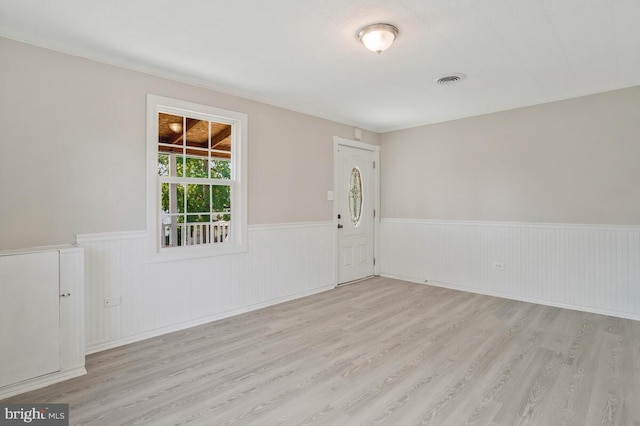 unfurnished room with light hardwood / wood-style floors