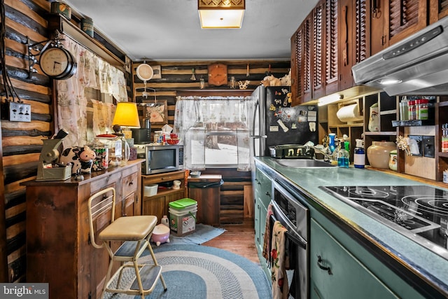 kitchen featuring appliances with stainless steel finishes and dark hardwood / wood-style flooring