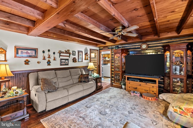 living room with beam ceiling, ceiling fan, and wooden ceiling