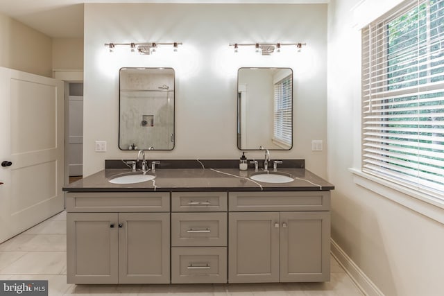 bathroom with tile patterned flooring and vanity