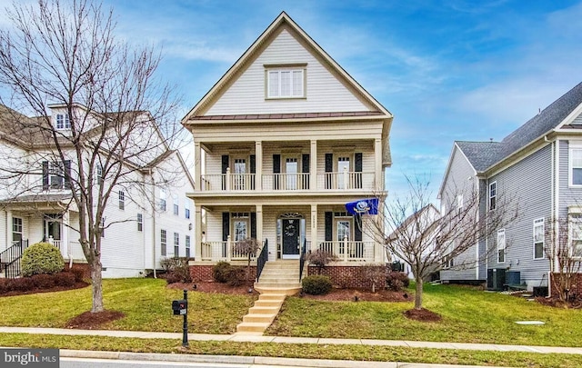 view of front of property with a front yard, a balcony, central AC unit, and covered porch