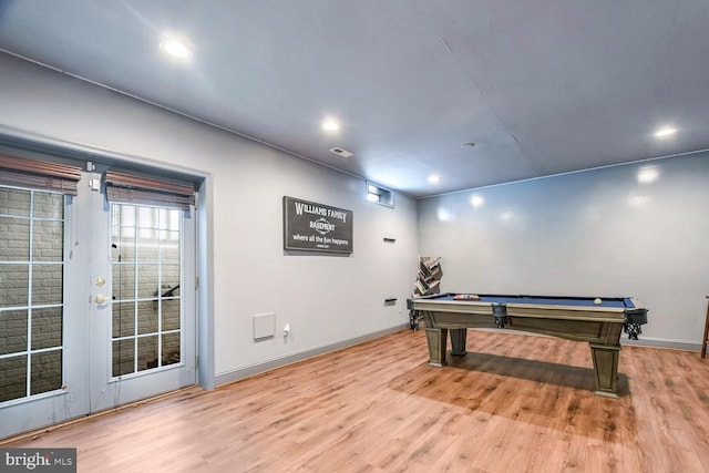 rec room with light hardwood / wood-style floors and pool table