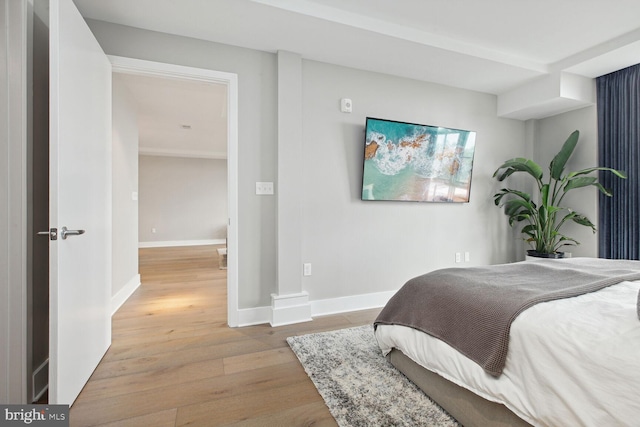 bedroom with light wood-type flooring