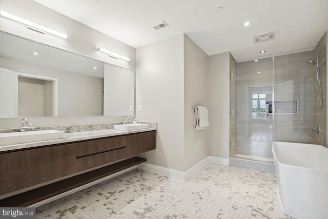 bathroom featuring tile patterned floors, vanity, and separate shower and tub