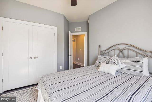 bedroom featuring visible vents, a closet, and ceiling fan