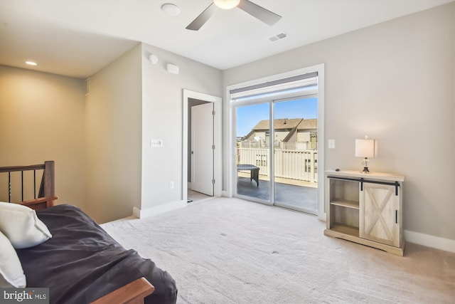 interior space with ceiling fan, access to exterior, and light carpet