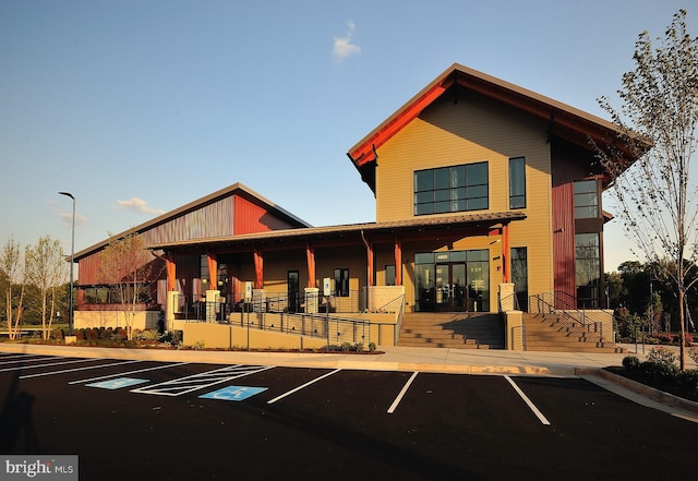 view of building exterior with uncovered parking