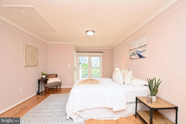 bedroom with access to outside, crown molding, and light hardwood / wood-style flooring