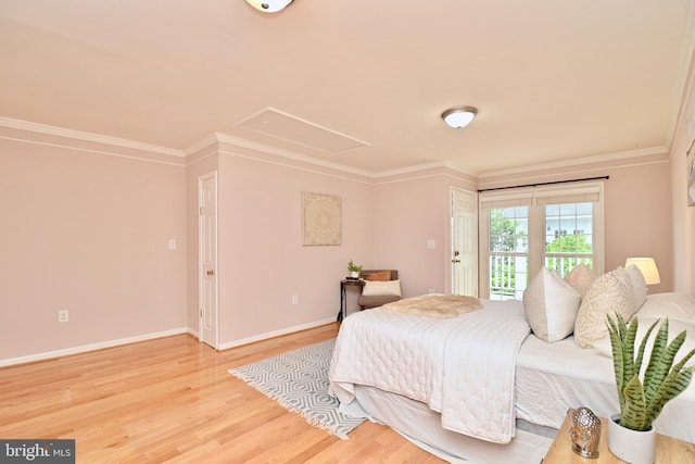 bedroom with wood-type flooring and crown molding