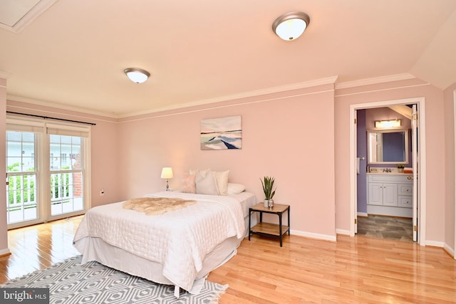 bedroom featuring access to outside, ensuite bathroom, sink, light hardwood / wood-style flooring, and ornamental molding