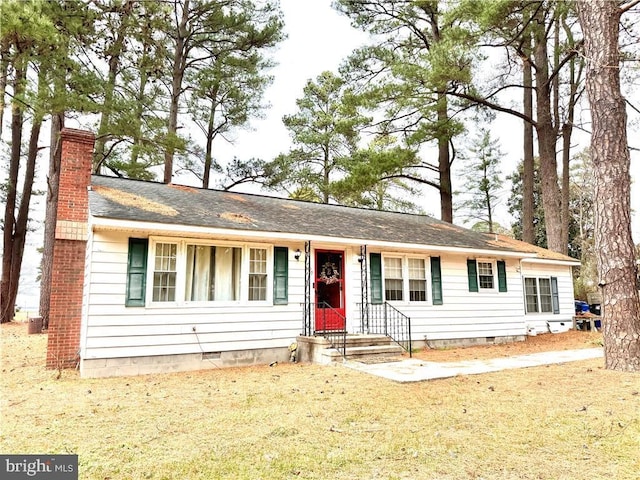 single story home with crawl space and a chimney