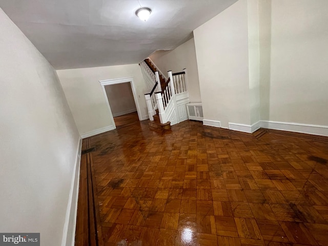 bonus room featuring dark parquet floors