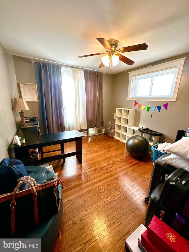 interior space featuring hardwood / wood-style floors and ceiling fan