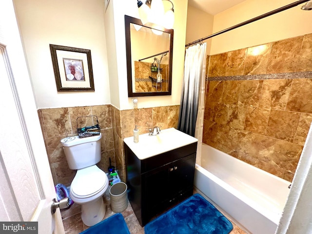 full bathroom with shower / bath combination with curtain, toilet, tile walls, and vanity