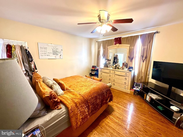 bedroom featuring hardwood / wood-style floors and ceiling fan