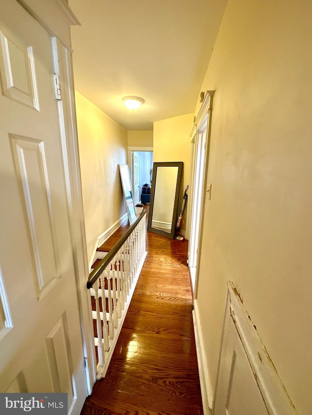 hallway featuring wood-type flooring