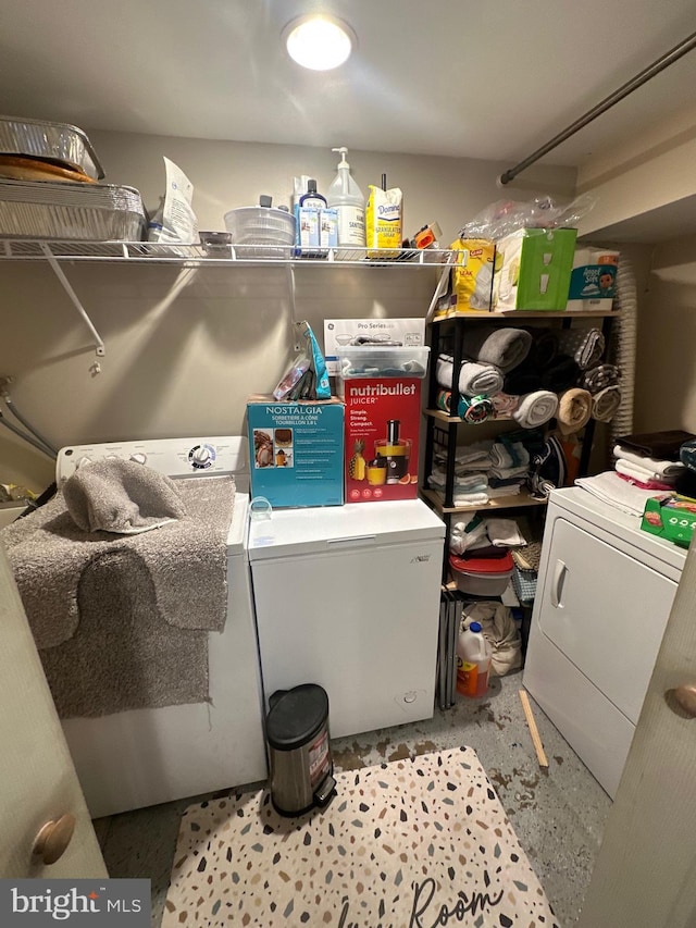 clothes washing area featuring washer and dryer