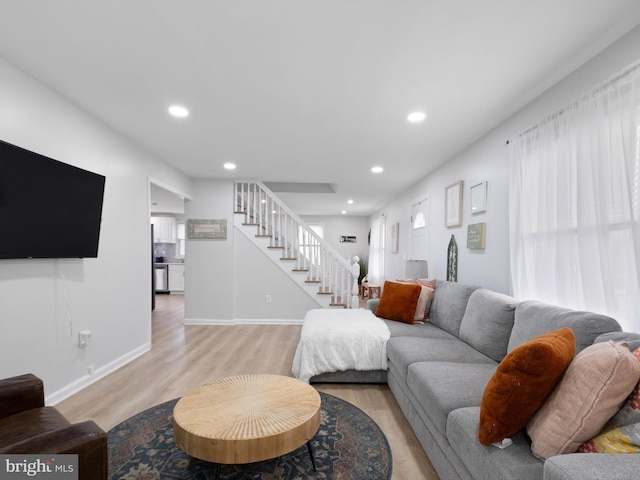 living room with light hardwood / wood-style floors