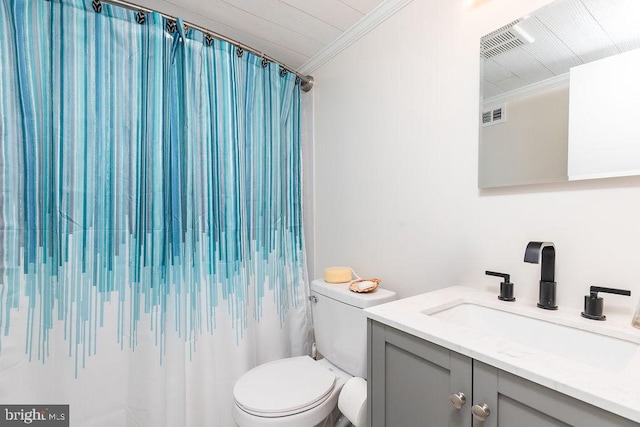 bathroom with vanity, toilet, curtained shower, and crown molding