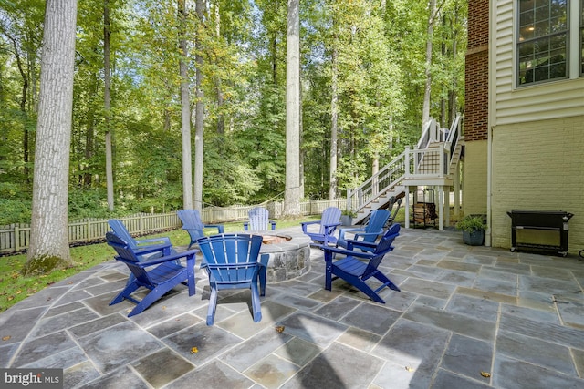 view of patio with a fire pit