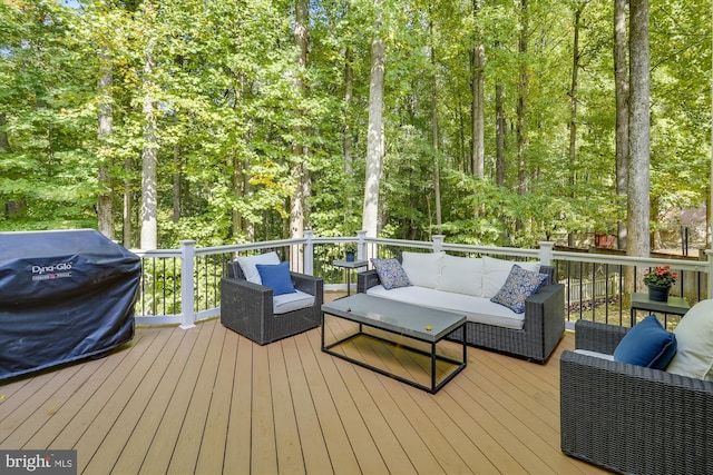 wooden terrace featuring a grill and outdoor lounge area