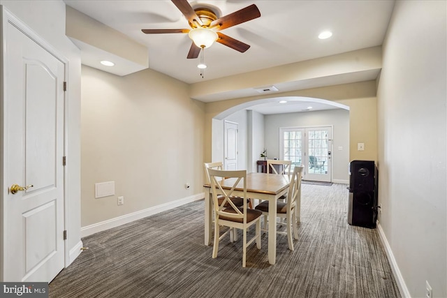 carpeted dining area featuring french doors and ceiling fan