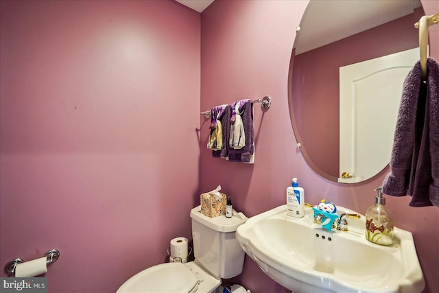 bathroom featuring sink and toilet