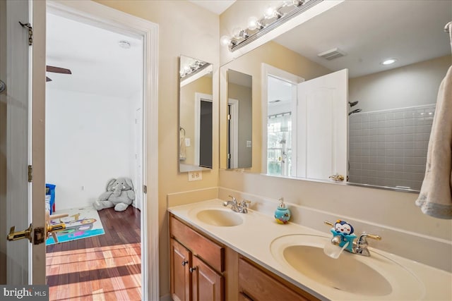 bathroom with vanity and ceiling fan