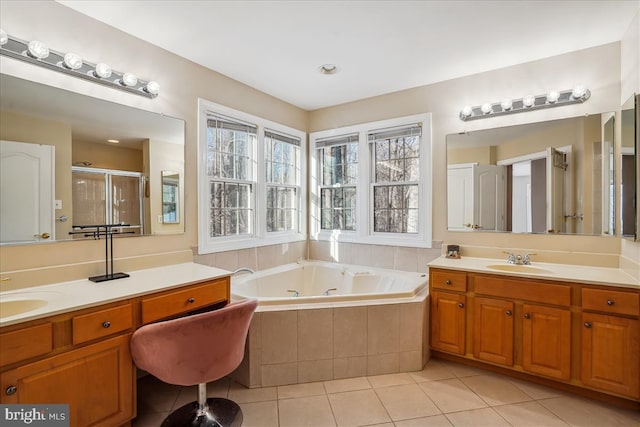 bathroom featuring shower with separate bathtub, tile patterned floors, and vanity