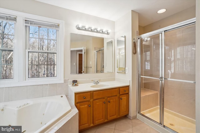 bathroom with vanity, tile patterned floors, and independent shower and bath