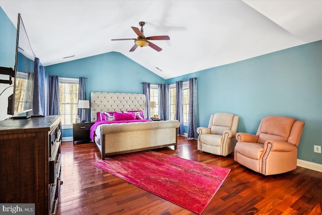 bedroom with ceiling fan, dark wood-type flooring, and lofted ceiling