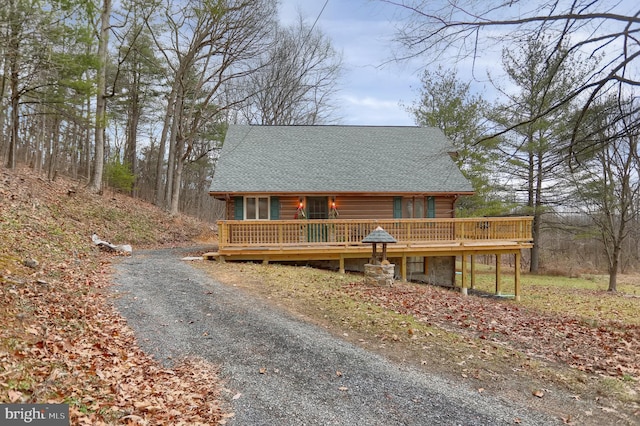 log home featuring a deck