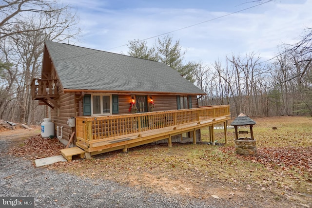 view of front facade with a wooden deck