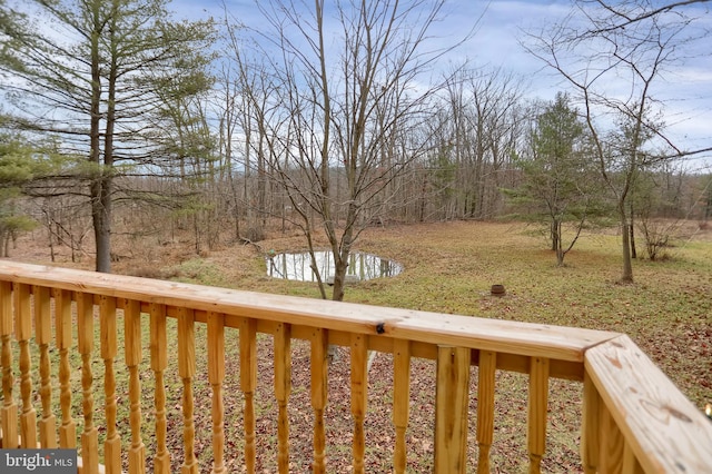 wooden deck with a water view