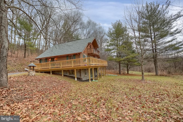 back of house featuring a wooden deck