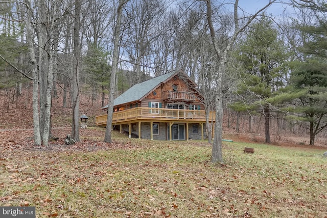 rear view of house with a wooden deck