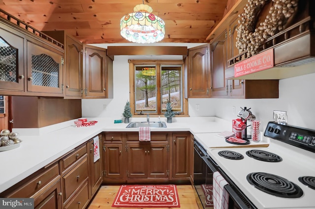 kitchen featuring premium range hood, white range with electric cooktop, sink, black dishwasher, and wood ceiling