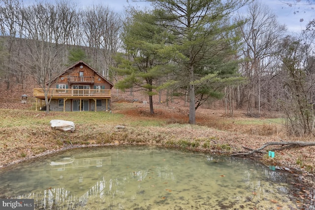 view of yard featuring a deck with water view