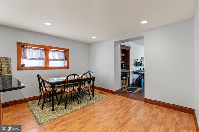 dining space featuring hardwood / wood-style floors