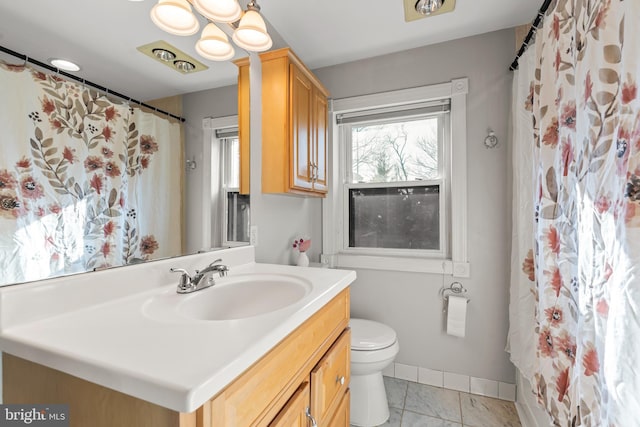 bathroom with vanity and toilet