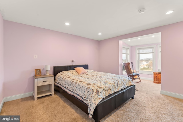 bedroom featuring light carpet