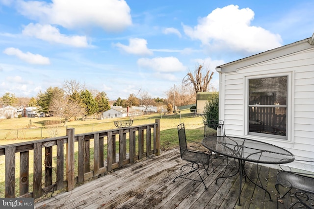 wooden terrace with a yard