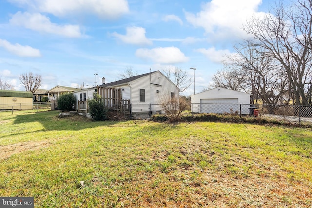 exterior space featuring a garage and an outbuilding