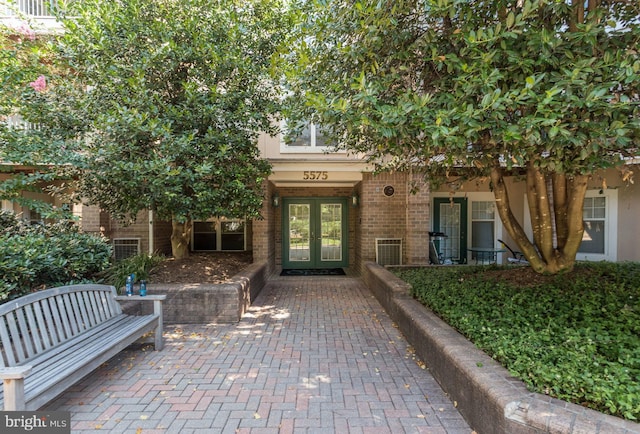 entrance to property featuring french doors