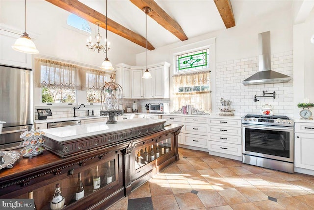 kitchen featuring backsplash, wall chimney range hood, beam ceiling, white cabinetry, and stainless steel appliances