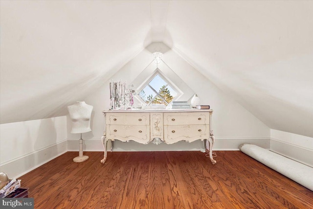 bonus room with wood-type flooring and vaulted ceiling