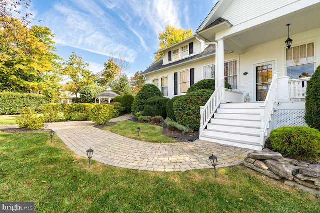 entrance to property with a yard