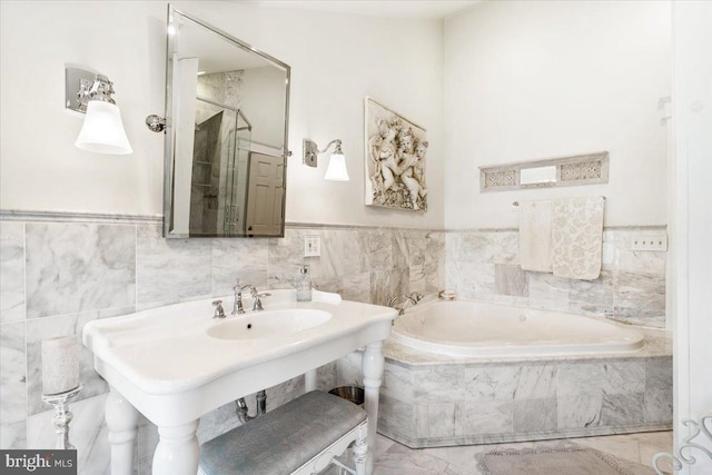 bathroom featuring tiled tub