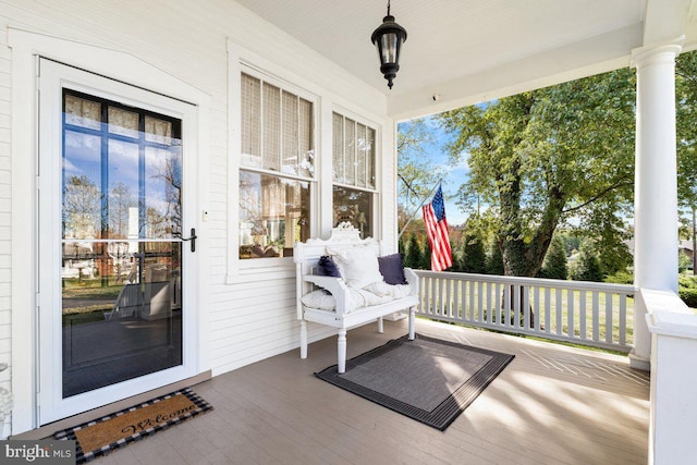 wooden terrace featuring covered porch