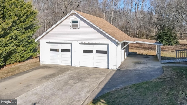 garage featuring a carport